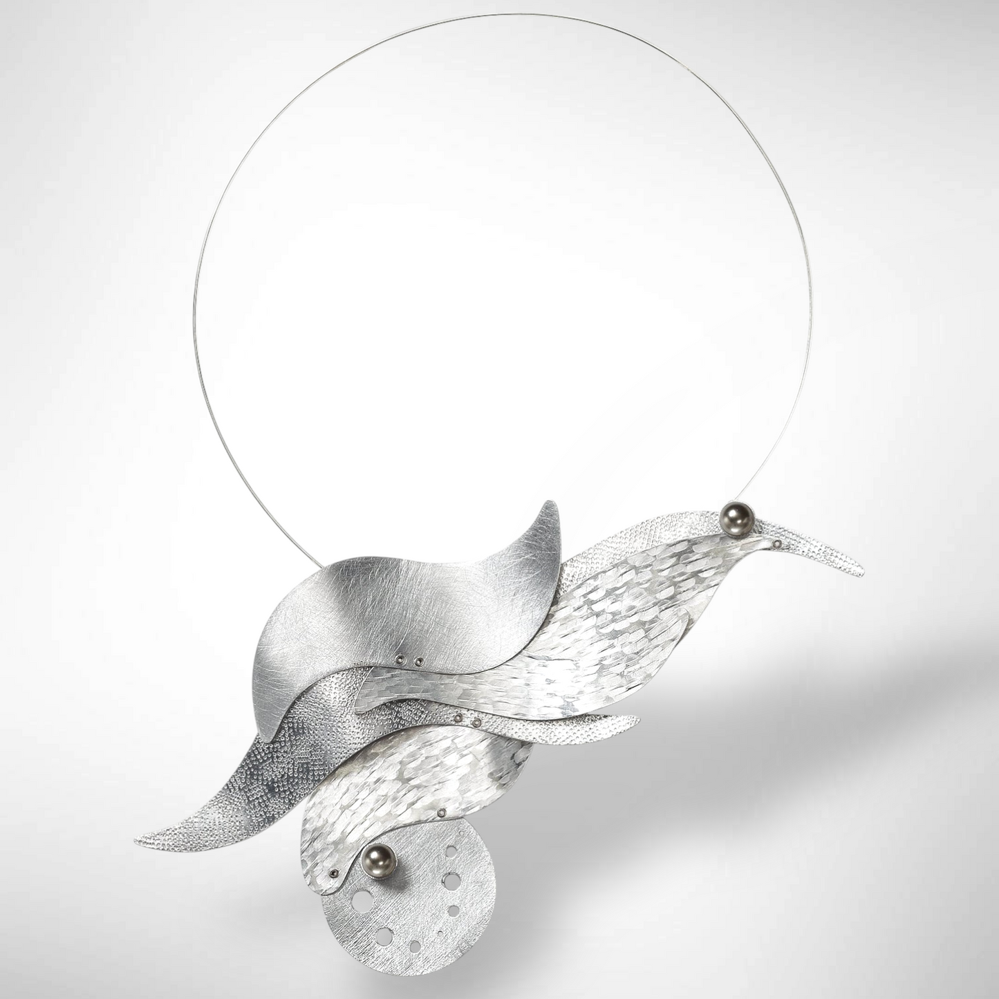 SURF Show Stopping Statement Necklace featuring flowing waves and sea foam design with front clasp from the WATER Collection