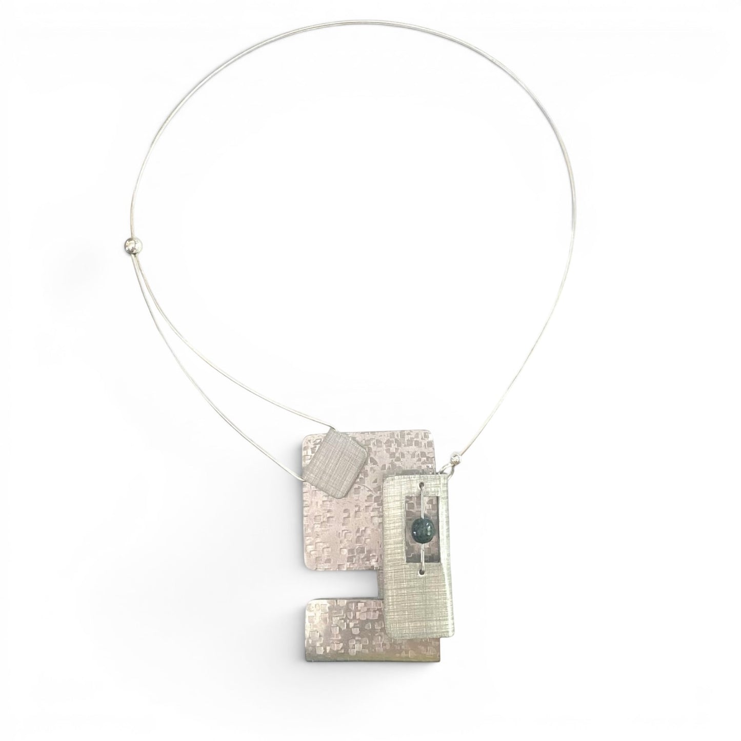 Chick Boss statement necklace with overlapping aluminum rectangles and a jade accent bead. Textured metal.